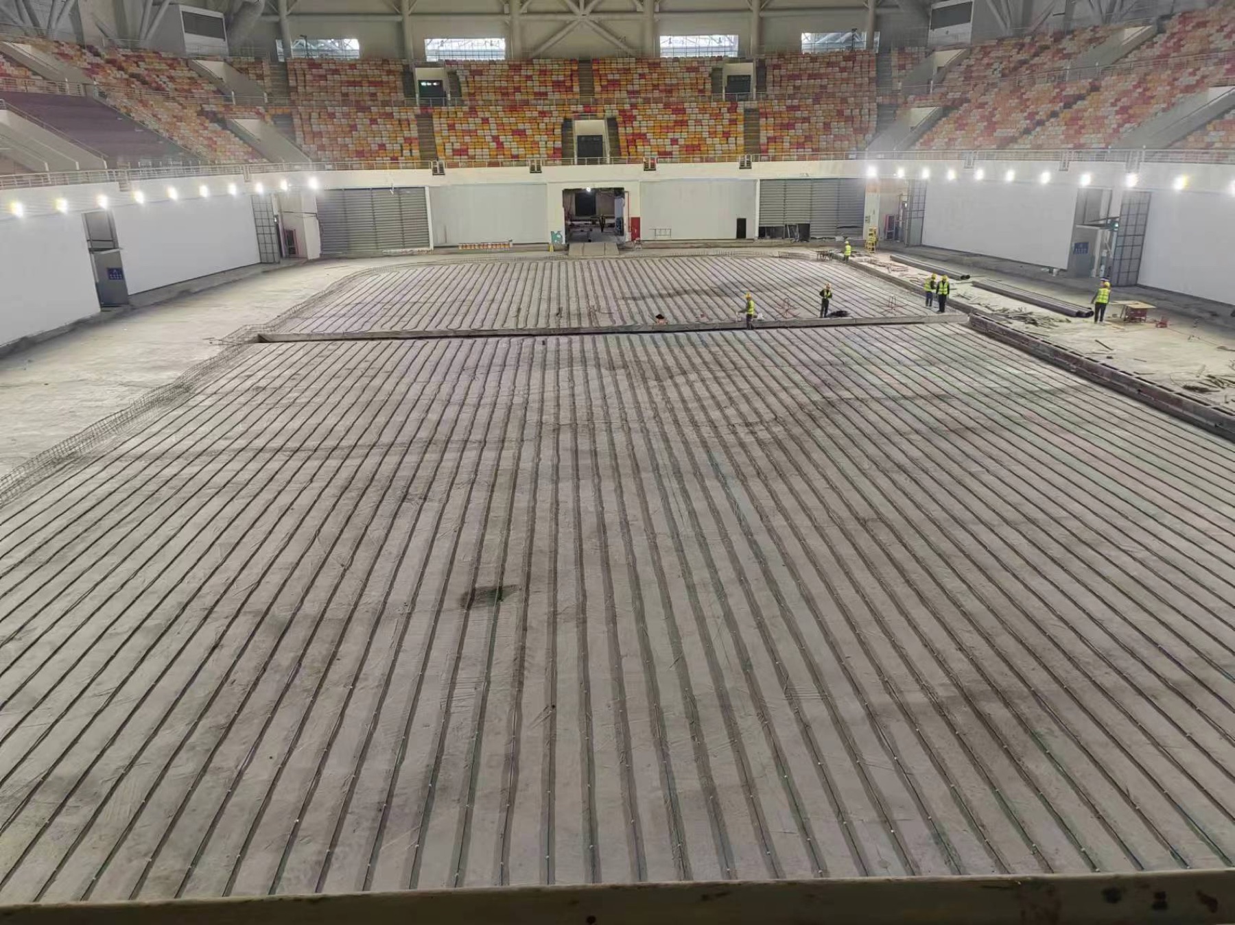 Detailed ice rink piping installation before the concrete pour